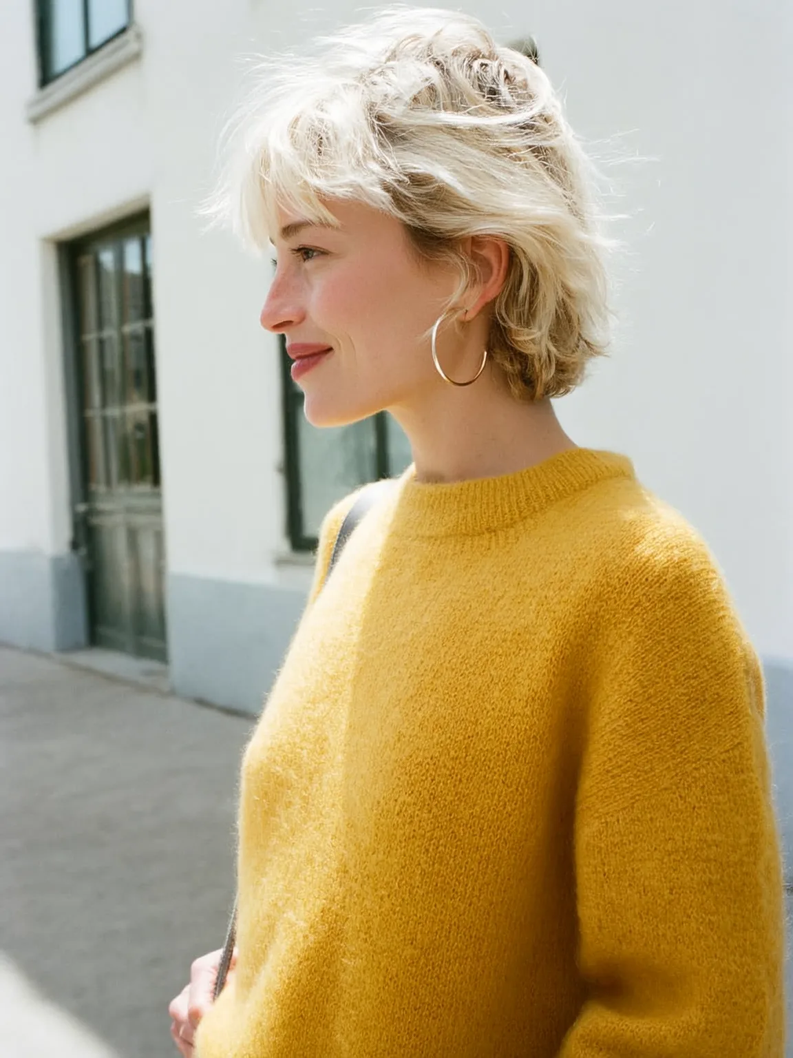 Tousled Platinum Blonde Pixie with Long Bangs